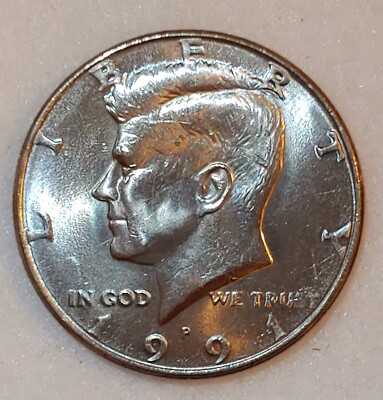 1991 Kennedy half dollar clashed die error showing reverse design transfer on obverse fields