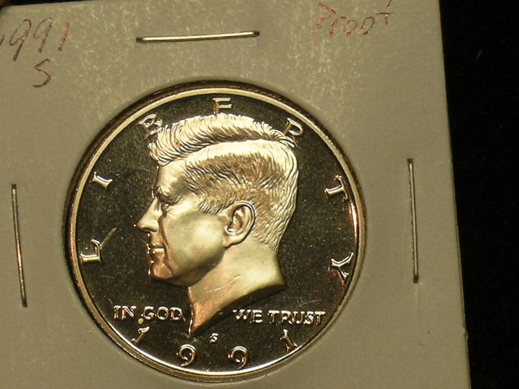 1991 Kennedy half dollar reverse showing FG designer initials area near eagle tail feathers